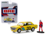 1969 Datsun 510 #33 BRE (Brock Racing Enterprises) with Race Car Driver Figure \"Bishop Exclusive\" 1/64 Diecast Model Car by Greenlight