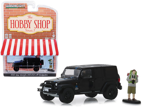 2012 Jeep Wrangler Unlimited \"MOPAR\" Off-Road Black with Backpacker Figurine \"The Hobby Shop\" Series 7 1/64 Diecast Model Car by Greenlight